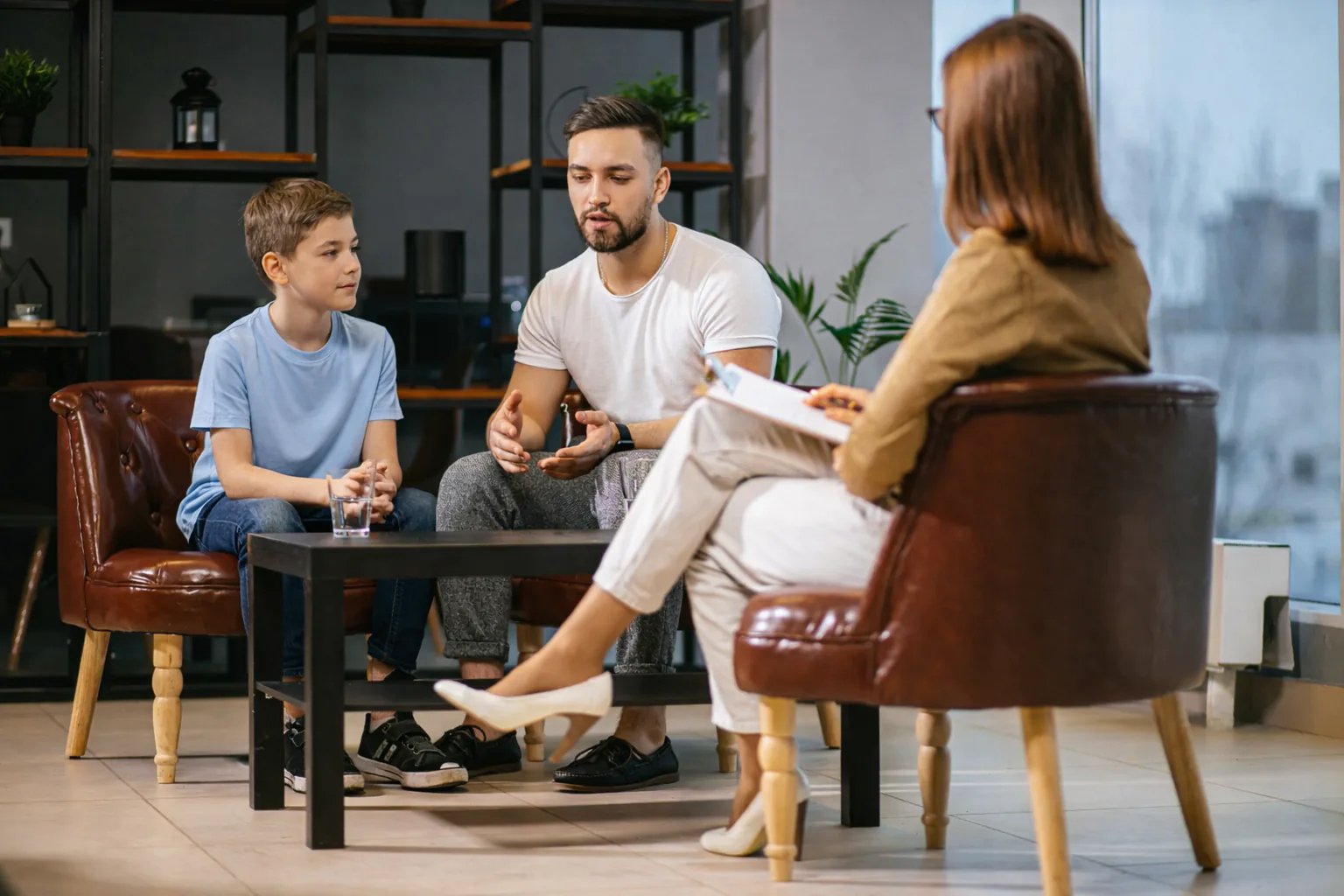 Parent and child in a meeting with an adviser